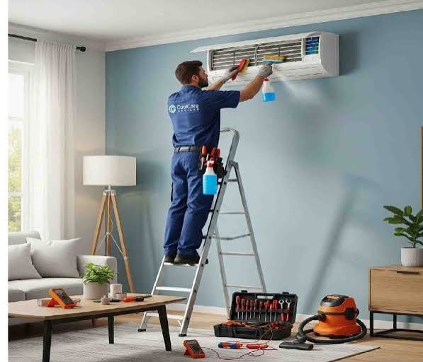 Technician servicing a wall-mounted air conditioner
